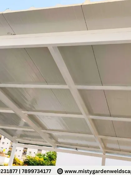 A close-up of the puff sheet roofing on a white metal frame. This combination provides a clean, bright, and insulated ceiling for the outdoor space, making it usable and comfortable in any season.