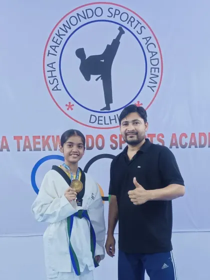 I am always proud to stand with my students after their victories. Here is Aliya with her well-deserved gold medal.