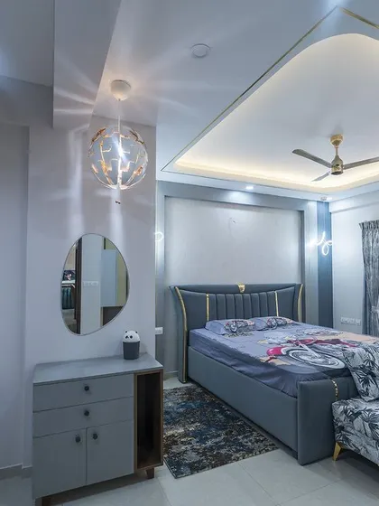 A mirrored image of the elegant blue and grey master bedroom, showcasing the cohesive design and luxurious feel.