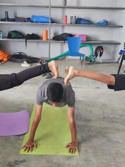 This three-person plank variation is a testament to the strength and stability of our campers.