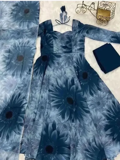 A deep blue Anarkali suit fabric with a large sunflower print. We can create a bold and beautiful statement dress from this material.