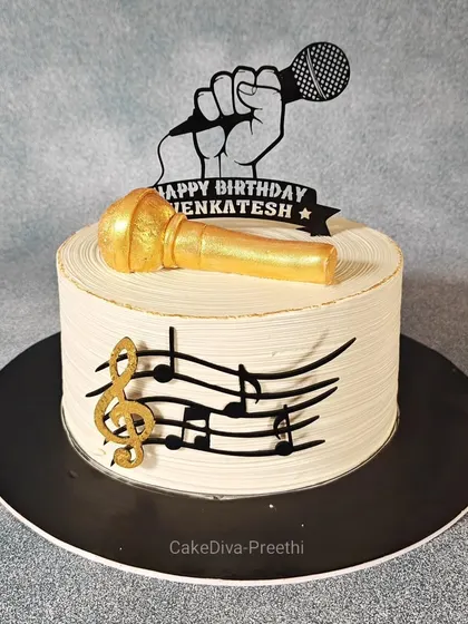 Worry less, sing more. A simple yet elegant cake for a karaoke lover, decorated with music notes and a golden microphone made of fondant.