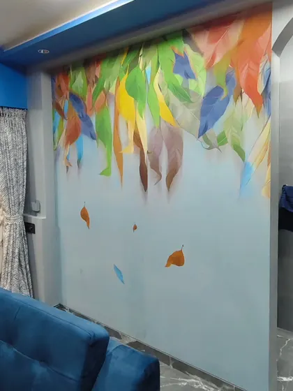 A modern and artistic wallpaper featuring colorful falling leaves. This design adds a dynamic and vibrant touch to the living space.