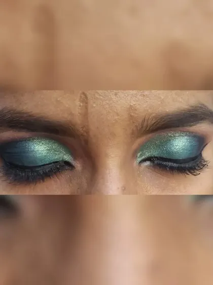 A detailed shot of a half-smokey eye with a metallic green finish. This is a great look for a party or a sangeet.