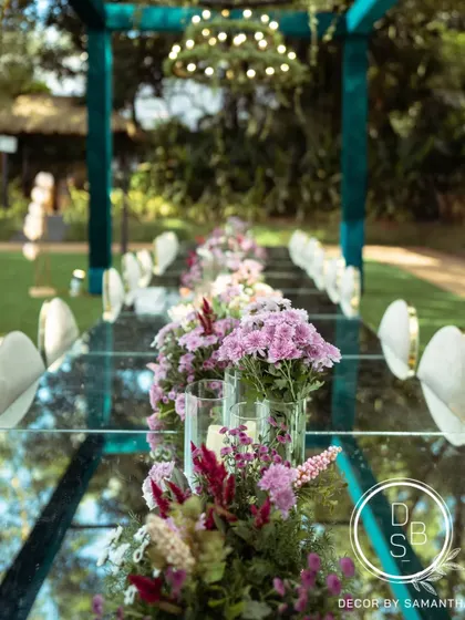 A close-up of the floral runner on the mirrored table. The reflection of the flowers and the sky above created a beautiful, multi-dimensional effect.