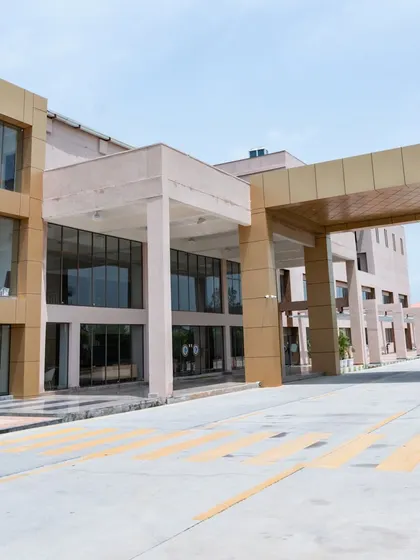 The entrance of a school is the gateway to its community. We designed this modern, impactful entrance for Konark Academy, featuring a strong architectural form with clean lines and a glass facade that signals a forward-thinking educational environment.