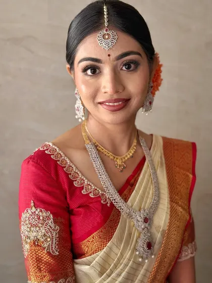 A portrait of my bride Jahnavi, showcasing her radiant muhurtha look. The makeup features clean lines, glowing skin, and a beautiful smile, perfect for her South Indian bridal style.