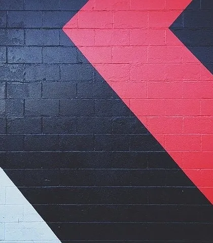 Geometric color-blocking on an exterior brick wall. I use sharp lines and bold colors to create modern, graphic designs on both interior and exterior surfaces.