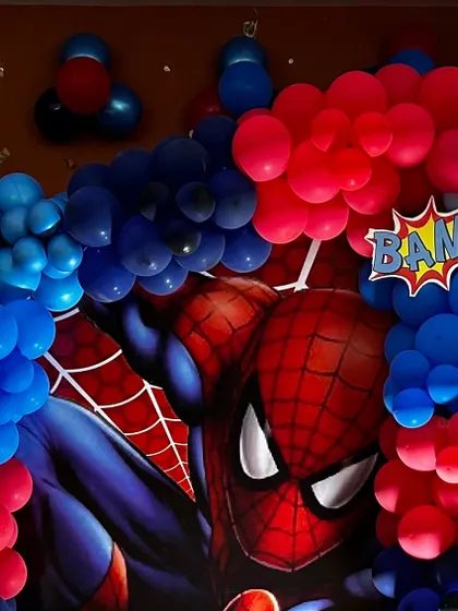 A close-up of a Spiderman backdrop with a "BAM!" comic book graphic. The vibrant colors and bold design are perfect for a superhero theme.