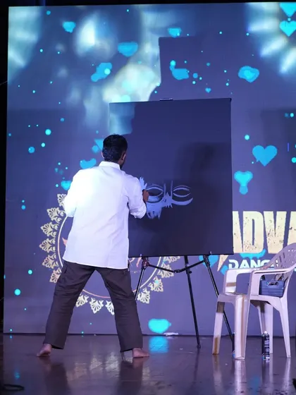 Getting started on a speed painting of a divine figure at the Advaya Dance Festival. The first few strokes are crucial for setting up the entire composition.