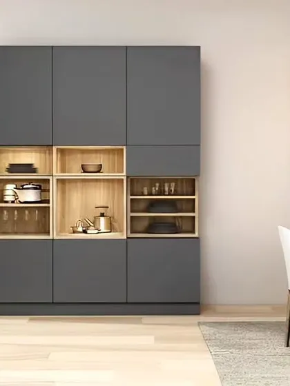 A modern and minimalist dining room storage unit. The sleek grey cabinet features open wooden niches, creating a beautiful contrast and a perfect spot for displaying decorative items.