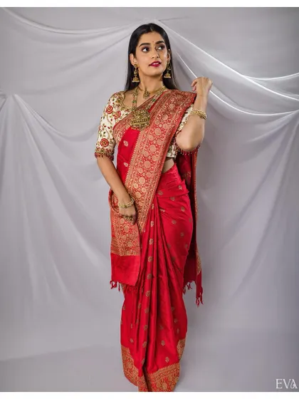An identical full-length shot, providing a clean and classic view of the red saree, perfect for e-commerce and brand lookbooks.