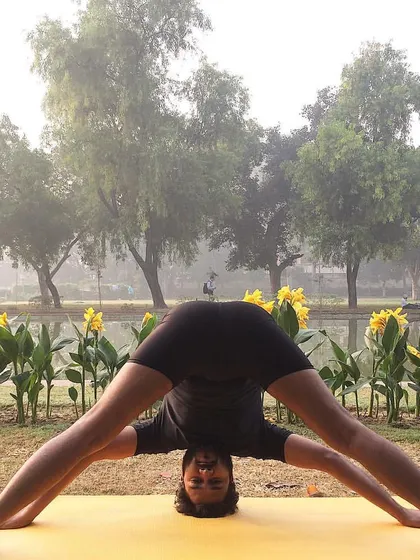Prasarita Padottanasana (Wide-Legged Forward Bend) is an inversion that stretches the hamstrings, calves, and hips. It brings fresh blood to the brain, leaving you feeling refreshed and calm.