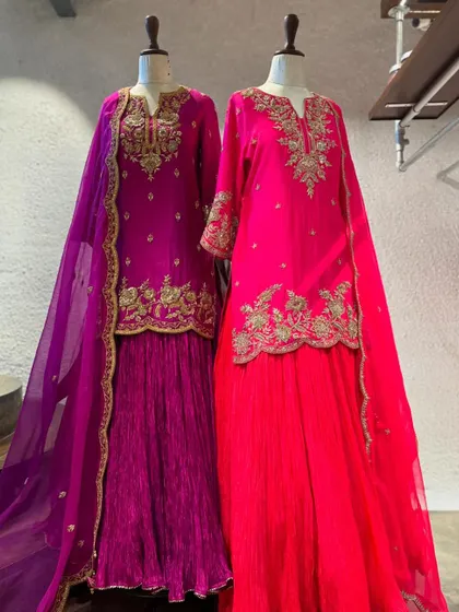 Rich magenta and purple sharara sets with gold embroidery. These outfits are designed to make a statement and are perfect for a sangeet or wedding reception.