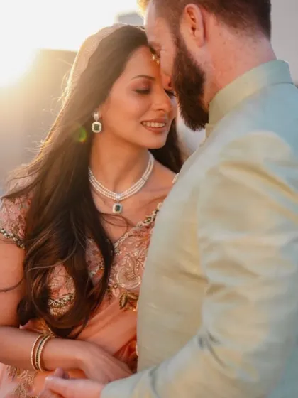 A close-up of the couple, showcasing the subtle coordination in their outfits and the genuine connection that made styling them such a joy.