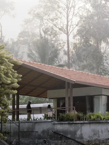 The house is perched on the edge of the estate, with a covered veranda offering panoramic views of the misty valley. This is a space designed for quiet contemplation and enjoying the cool climate.