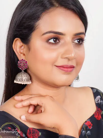 This close-up for a jewellery brand highlights a ruby-studded jhumka. I used a soft pink lip and subtle eye makeup to complement the color of the stones without distracting from the product itself.