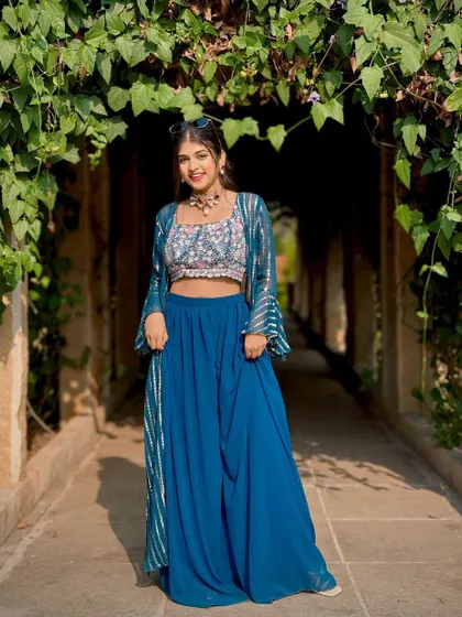 A modern and chic look for a festive party or mehendi function. This indo-western outfit is paired with a unique, contemporary choker that makes a style statement.