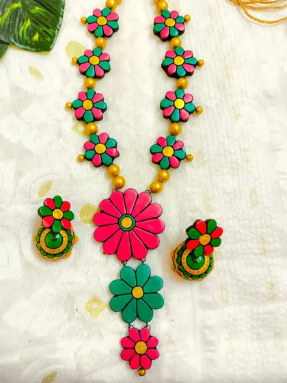 These are additional images of the floral necklace sets in various colors, showcasing the wide range of options available for bulk purchase.