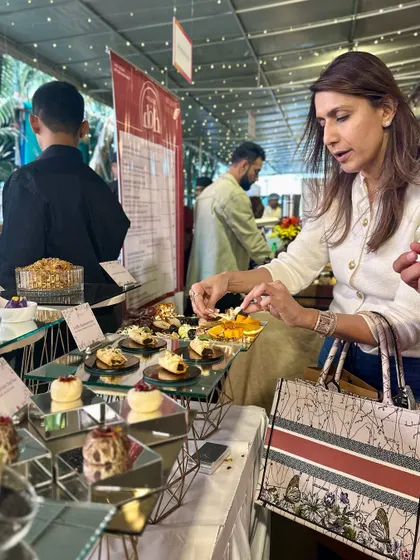 A guest making her selection from our array of handcrafted appetizers.