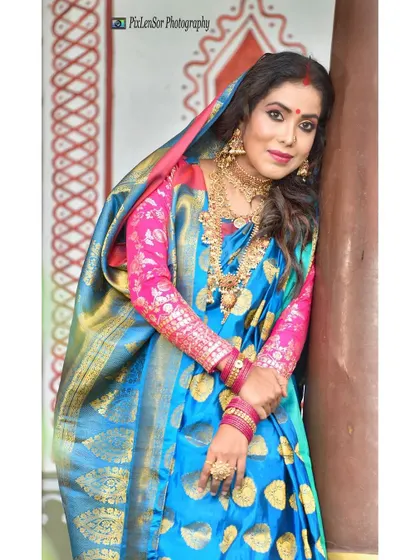 A close-up portrait from the Bengali-themed shoot, showing the choker, jhumkas, and maang tikka.