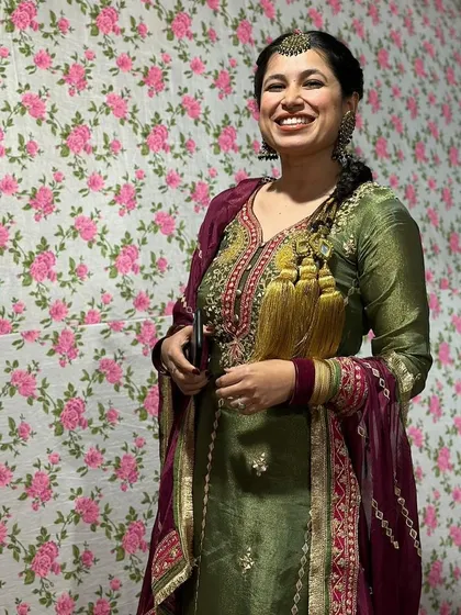 A beautiful Punjabi suit look. The olive green and wine color combination is rich and festive, perfect for a Lohri celebration or a Dhol night.