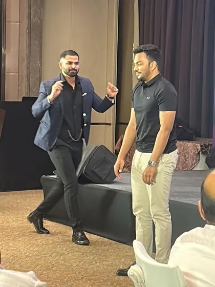 A dynamic moment of performance during a team session. I use body language and movement to keep the energy high and the audience captivated.