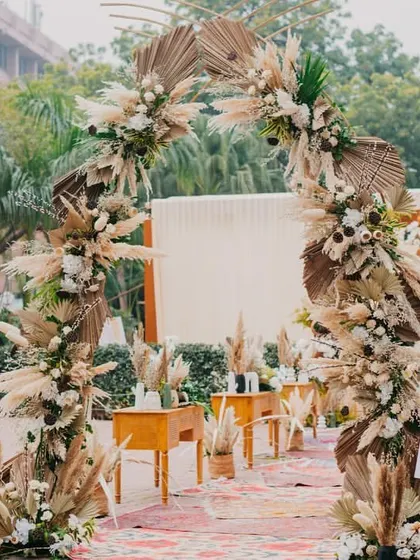 Your love story is unique, and your decor should be too. For this couple, we created a rustic and chic 'Farmer's Market' theme, complete with pampas grass arches and fresh produce, telling their story in every detail.