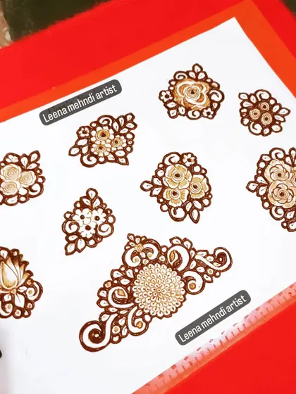 A full sheet of floral motif drills. Consistent practice with these basic shapes is the fastest way to improve your henna skills.