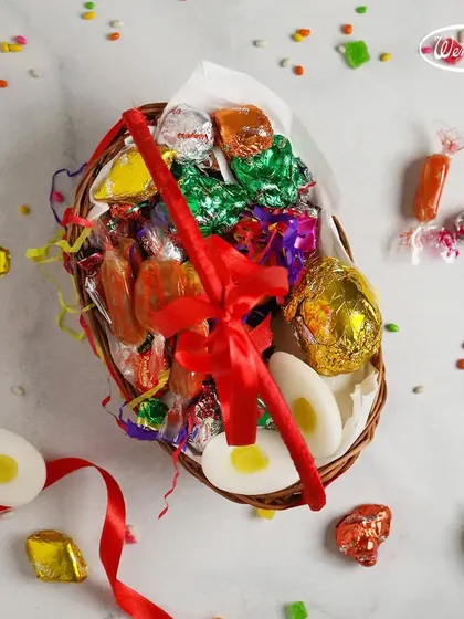 An Easter basket overflowing with a variety of our wrapped chocolates and candies. It's a perfect gift to share the joy of the festival.