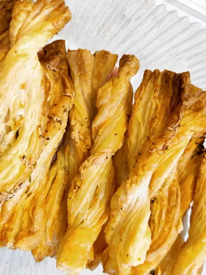 Our flaky and buttery cheese straws, twisted and baked to a perfect golden crisp. We offer them in classic, herb, and pepper flavours.