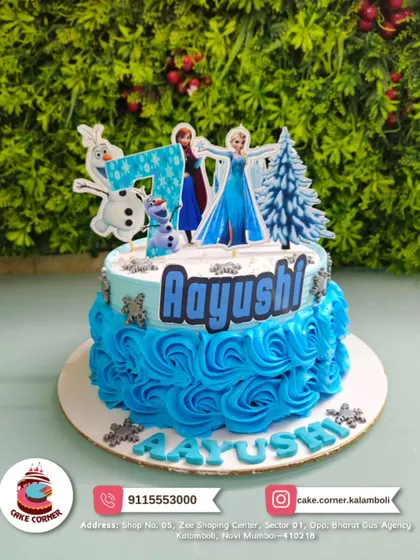 A beautiful Frozen-themed cake with blue rosettes for Aayushi's 7th birthday. The design includes Elsa, Anna, and Olaf for a complete Arendelle adventure.
