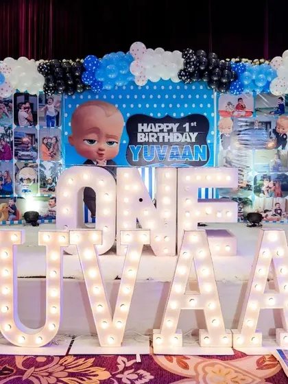 A first birthday is a huge milestone, and I made sure this Boss Baby theme party was one to remember. The stage featured large light-up letters for the birthday boy's name, a personalized photo backdrop, and of course, the Boss Baby himself.