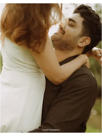 A low-angle shot focusing on the groom's adoring gaze. We find unique perspectives to tell a more emotional and compelling story.