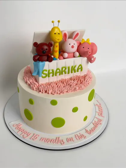 Another angle of the charming toy box cake, showing the playful polka dot design on the bottom tier.