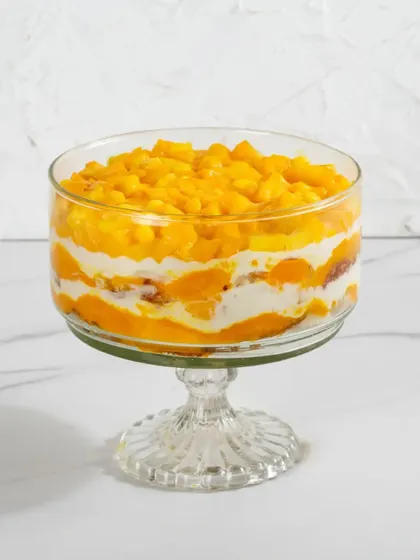 A studio shot of our Mango Cream Cheese Trifle, highlighting its fresh and fruity layers.
