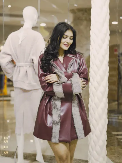 Another shot of the burgundy coat. The fit and flare silhouette is very flattering and adds a touch of drama.