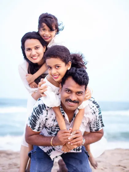 A fun and playful family stack. This creative pose brings everyone close for a happy, memorable shot that perfectly reflects their fun-loving dynamic during their outdoor family photoshoot.