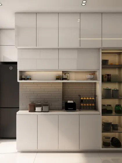 A minimalist all-white kitchen with high-gloss cabinets, a built-in pantry with glass doors, and integrated lighting for a clean and futuristic look.