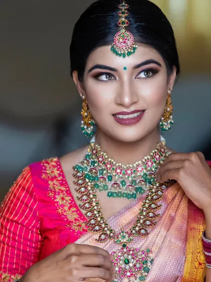 A stunning model from a collaboration with a makeup artist, wearing our ruby and emerald haram.