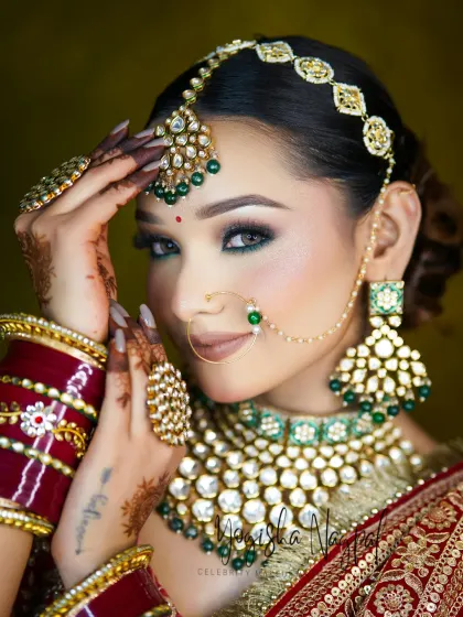 A breathtaking bridal portrait showcasing the power of expertly applied makeup. The green smokey eye and flawless contouring create a look that is both regal and unforgettable.