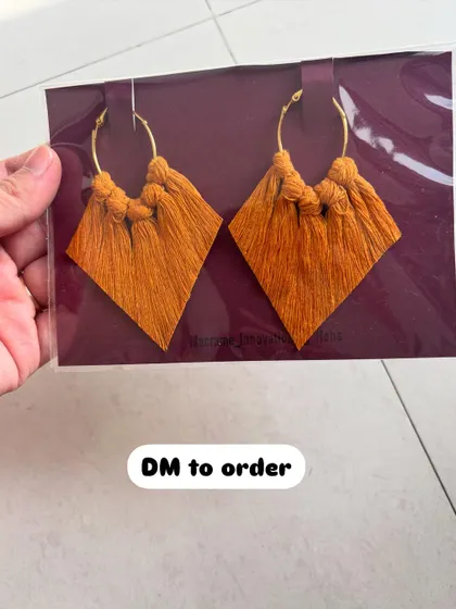 These mustard yellow macrame earrings are perfect for adding a pop of warm color to your look. The diamond tassel design is one of my favorites.