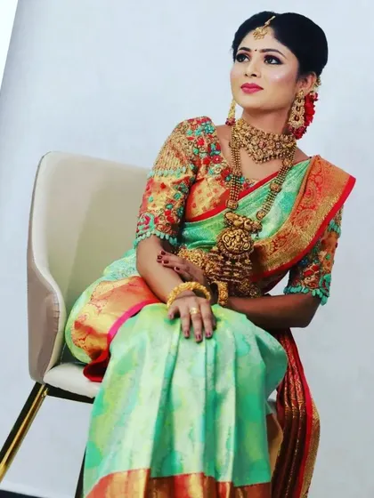 A full-length shot from a jewellery marketing campaign. The makeup is balanced to look stunning from a distance, with emphasis on glowing skin and eyes that connect with the camera, making the entire look feel regal.