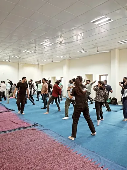 A group of participants practicing their fighting stance and movement. Footwork and balance are the foundation upon which all effective techniques are built.