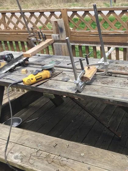 The workbench tells the story. Tools, clamps, and metal parts show the sifter being rebuilt once again. This is our design 5.5, a testament to not giving up.