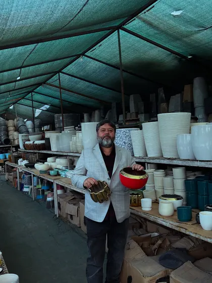 Here I am in our pots and planters section, showing a couple of our unique ceramic pots. We have a huge variety, so you are sure to find something that fits your style and budget.