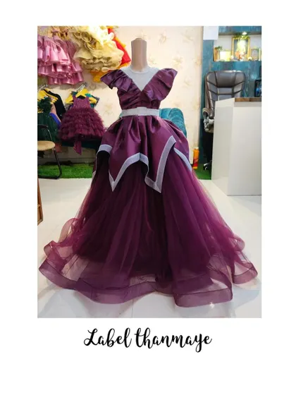 A dramatic purple prom gown I designed. It has a unique silhouette with a full tulle skirt.