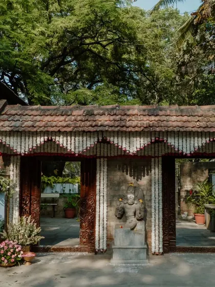 The main gates of the heritage venue are adorned with traditional jasmine garlands, offering a classic and fragrant welcome.