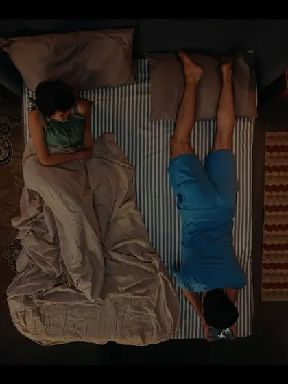 A creative top-down shot from the Bullet Echo campaign. The styling of the two characters in bed, one sleeping and one gaming, tells a simple, funny story.