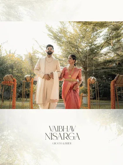 A grand portrait of the bride and groom, Vaibhav and Nisarga. The wide-angle shot captures the beautiful decor and the elegance of their wedding day.